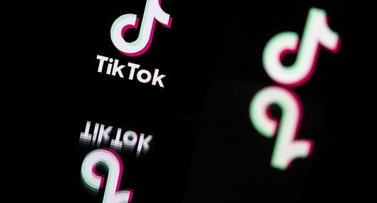 This photograph taken in Mulhouse, eastern France on October 19, 2023, shows the logo of the social media video sharing app Tik Tok reflected in mirrors. (Photo by SEBASTIEN BOZON / AFP)