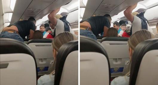 Momento en el que una pasajera del vuelo de Avianca a Barranquilla se desmaya del susto por el fuerte vendaval