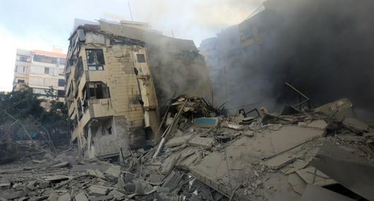 Smoke rises from buildings hit in an overnight Israeli airstrike that targeted the neighbourhood of Al-Jamous in Beirut's southern suburbs on October 3, 2024. - Israel kept up its bombardment of Beirut after Iran launched its second, and largest, attack on Israel in months, which prompted Prime Minister Benjamin Netanyahu to warn Tehran would pay. (Photo by AFP)