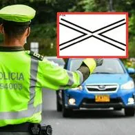 ¿Sabe qué significa la señal X blanca en medio de la vía? Ignorarla sale caro en Colombia