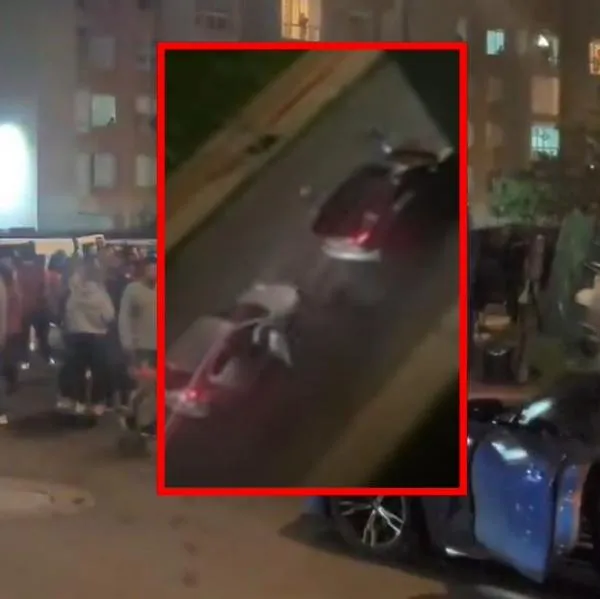 Captura de pantalla de video de cámara de seguridad que muestran el intento de robo de una camioneta en Bogotá.