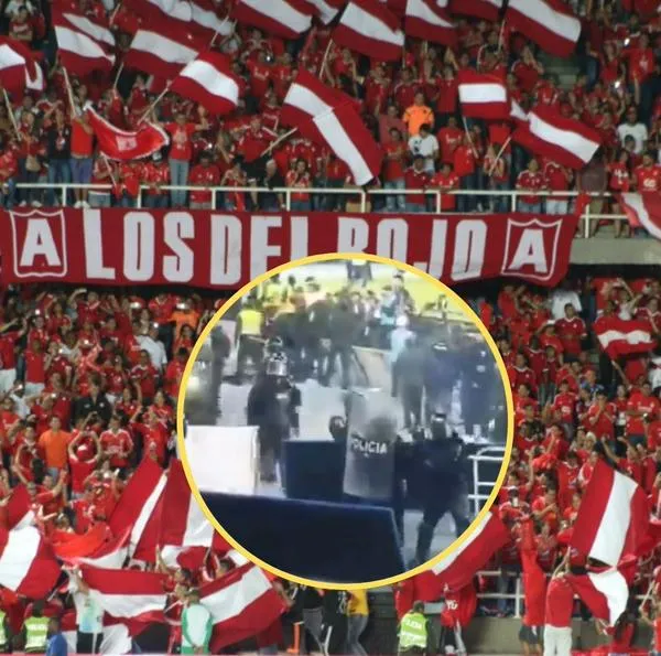 Durante el juego se observó a un ‘simpatizante’ dispararle a los uniformados que intentaban evitar los desmanes en el estadio.