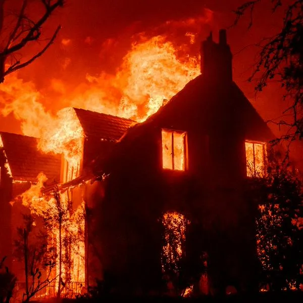 A home burns during the Eaton fire in the Altadena area of Los Angeles County, California on January 8, 2025. (Photo by JOSH EDELSON / AFP)