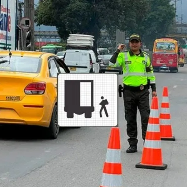 Foto de agente de tránsito y señal, en nota sobre cuándo arrancan nuevas señales de tránsito en Colombia: fecha pronto, con multas