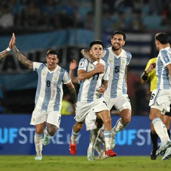 Argentina's midfielder #11 Thiago Almada (3rd R) celebrates with teammates after scoring during the 2026 FIFA World Cup South American qualifiers football match between Uruguay and Argentina at the Centenario stadium in Montevideo, on March 21, 2025. (Photo by Eitan ABRAMOVICH / AFP)