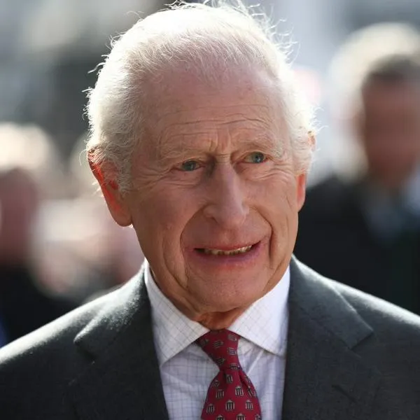 (FILES) Britain's King Charles III meets well-wishers as he arrives with Britain's Queen Camilla to visit the Roe Valley Arts and Cultural Centre, in Limavady, on March 20, 2025, during a three-day trip to Northern Ireland. Britain's King Charles III on March 27, 2025, was forced to cancel his appointments after suffering "side effects" following his cancer treatment, Buckingham Palace said in a statement. (Photo by HENRY NICHOLLS / POOL / AFP)