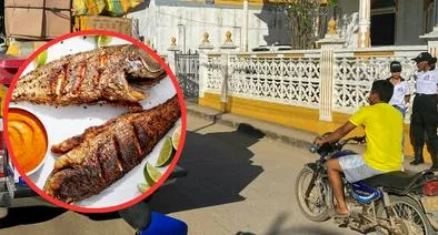 Plato de pescado y calle Lorica, de Córdoba, en nota sobre cuál es la la capital del bocachico en Colombia 