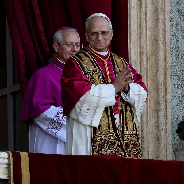 VATICAN CITY, VATICAN - MAY 8: The newly elected Pontiff, Pope Leo XIV is seen for the first time from the Vatican balcony on May 8, 2025 in Vatican City, Vatican. Cardinal Robert Prevost will be known as Pope Leo XIV. White smoke was seen over the Vatican early this evening as the Conclave of Cardinals took just two days to elect the new Pontiff after the death of Pope Francis on Easter Monday. (Photo by Antonio Masiello/Getty Images)