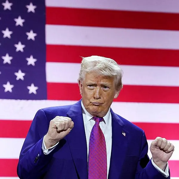 DOHA, QATAR - MAY 15: U.S. President Donald J. Trump gestures on stage as he tours the Al Udeid Air Base on May 15, 2025, in Doha, Qatar. Trump is on the third day of his visit to the Gulf to underscore the strategic partnership between the United States and Qatar, focusing on regional security and economic collaboration.  (Photo by Win McNamee/Getty Images)