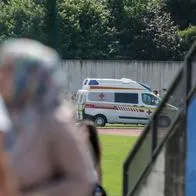 An ambulance car stands near a school where several people died in a shooting, on June 10, 2025 in Graz, southeastern Austria. Ten people died after a suspected shooter opened fire in a southeastern Austrian school, press agency APA quoted Graz city mayor Elke Kahr as saying. Several students and at least one adult are among those killed, Kahr confirmed to APA. (Photo by Alex HALADA / AFP)