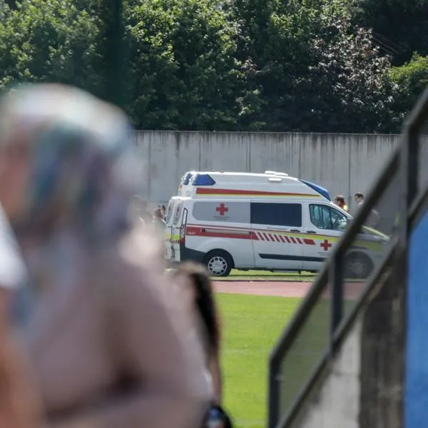 An ambulance car stands near a school where several people died in a shooting, on June 10, 2025 in Graz, southeastern Austria. Ten people died after a suspected shooter opened fire in a southeastern Austrian school, press agency APA quoted Graz city mayor Elke Kahr as saying. Several students and at least one adult are among those killed, Kahr confirmed to APA. (Photo by Alex HALADA / AFP)