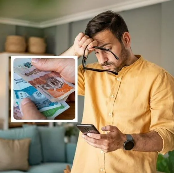 Foto de hombre y dinero, en nota de qué pasa si se deja de pagar una deuda menor de $500.000 en Colombia, duda común