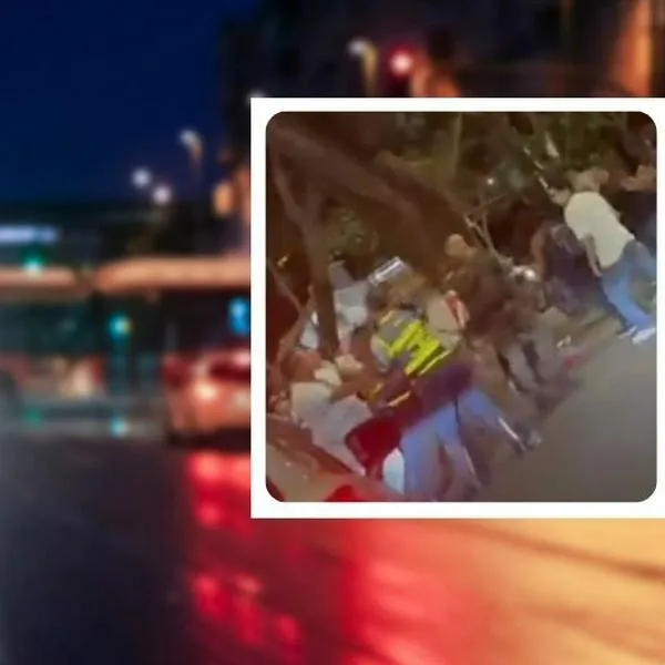 Fotos calle y pelea en Sexta Avenida, Pelea por operativo en Sexta Avenida de Cali quedó en video, con duras imágenes