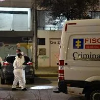 Forensic workers and police officers inspect the crime scene where the Director of La Modelo prison Elmer Fernandez was murdered in Bogota on May 16, 2024. Elmer Fernandez a retires police colonel was shot dead Thursday in Bogota after receiving several death threats, the government said. (Photo by: Cristian Bayona/Long Visual Press/Universal Images Group via Getty Images)