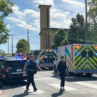 Police and first responders work at the scene of a shooting near Annunciation Church and Catholic School in Minneapolis, Minneosta, on August 27, 2025. Two children were shot dead when a gunman attacked a Minneapolis church on Wednesday, with 17 people injured, 14 of them children, police said. The gunman "began firing a rifle through the church windows towards the children sitting in the pews at the mass," Minneapolis police chief Brian O'Hara told reporters. The pupils were marking the first week of the school year when the attack occurred. (Photo by Tom BAKER / AFP)