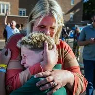 A parent hugs her son during an active shooter situation at the Annunciation Church in Minneapolis, Minn., on Wednesday, Aug. 27, 2025.] (Photo by RICHARD TSONG-TAATARII/The Star Tribune via Getty Images)