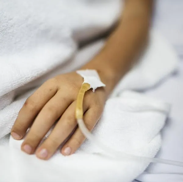 Closeup of hand with IV tube