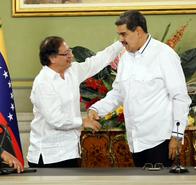 Venezuelan President Nicolás Maduro (R) and Colombian President Gustavo Petro shake hands after a meeting at the Miraflores Presidential Palace in Caracas, on November 18, 2023. (Photo by Pedro Rances Mattey / AFP)