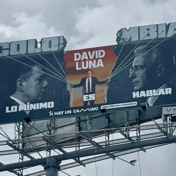 Valla de David Luna que pone de frente a Álvaro Uribe y Juan Manuel Santos