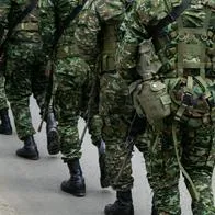 Colombian army patrolling the streets, military forces on urban patrol in Colombia, soldiers securing the streets in Colombia, army troops conducting street patrol, Colombian military presence in urban areas. High quality photo