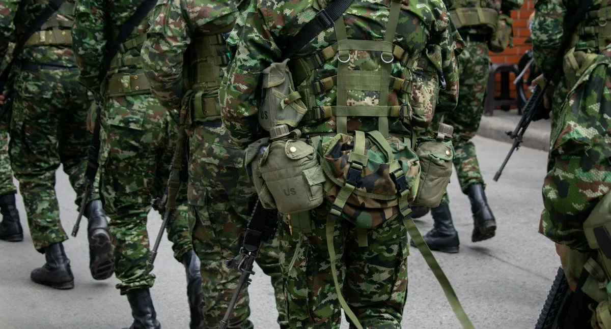 Colombian army patrolling the streets, military forces on urban patrol in Colombia, soldiers securing the streets in Colombia, army troops conducting street patrol, Colombian military presence in urban areas. High quality photo