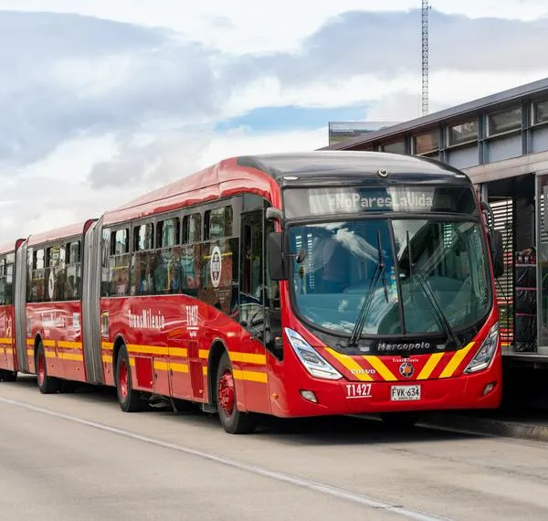 Transmilenio bus arriving at a passenger station on an avenue in the capital of Colombia, Bogotá. Colombia. July 30, 2021