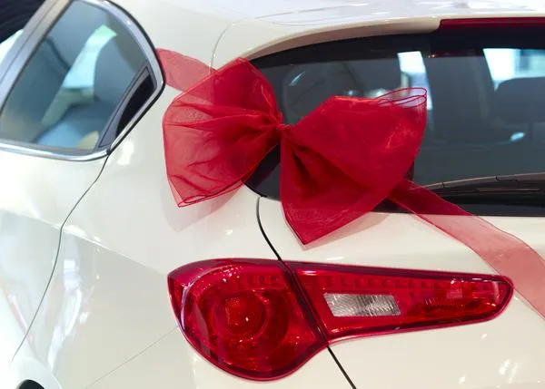 New car with red ribbon and red bow