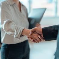 Cropped shot of business people standing in a modern office, shaking hands after having a successful meeting and reaching an agreement. Welcoming new hire. Celebrating success and achievement.