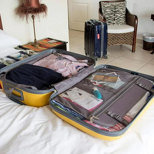 Open suitcase with holiday clothing being packed. (Photo by: Education Images/Universal Images Group via Getty Images)