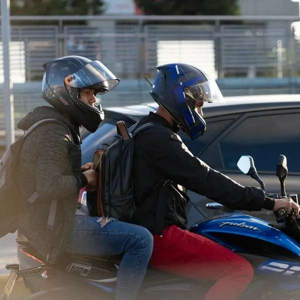 Motorcyclist passing cars in a traffic jam in the Colombian capital in the afternoon. Bogota. Colombia . July 18, 2023.