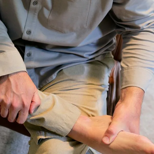 Middle Aged Man IT Band Physical Therapy Standing Desk Exercises Working From Home Remote - Sedentary Office Occupations - Sitting Harms Desk Staff